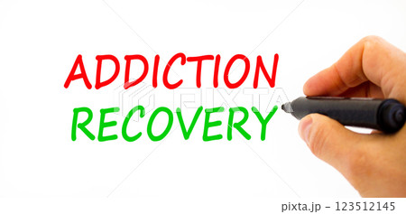Addiction recovery symbol. Concept words Addiction recovery on beautiful white paper. Psychologist hand. Beautiful white paper background. Psychology addiction recovery concept. Copy space. Addiction recovery symbol. Concept words Addiction recovery on beautiful white paper. Psychologist hand. Beautiful white paper background. Psychology addiction recovery concept. Copy space. 123512145
