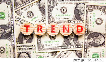 Trend and trending symbol. Concept word Trend on beautiful wooden circles. Beautiful dollar bills. Beautiful background from dollar bills. Business lifestyle trend and trending concept. Copy space. 123512186