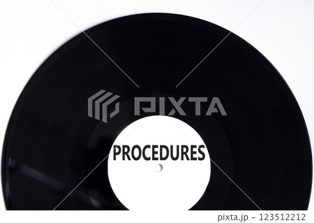 Procedures symbol. Concept word Procedures on beautiful black white vinyl disk. Beautiful white background. Business procedures concept. Copy space. 123512212