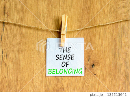 The sense of belonging symbol. Concept words The sense of belonging on beautiful white paper on clothespin. Beautiful wooden background. Business and the sense of belonging concept. Copy space. The sense of belonging symbol. Concept words The sense of belonging on beautiful white paper on clothespin. Beautiful wooden background. Business and the sense of belonging concept. Copy space. 123513641