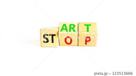 Start or stop symbol. Concept words Start or Stop on beautiful wooden block. Beautiful white table white background. Business start or stop concept. Copy space. 123513666