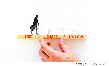 Like share follow symbol. Concept words Like Share Follow on beautiful wooden blocks. Beautiful white background. Businessman hand. Business like share follow concept. Copy space. 123513673