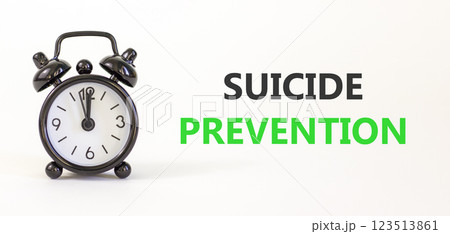 Suicide prevention symbol. Concept words Suicide prevention on beautiful white paper. Black alarm clock. Beautiful white paper background. Psychological and suicide prevention concept. Copy space. 123513861