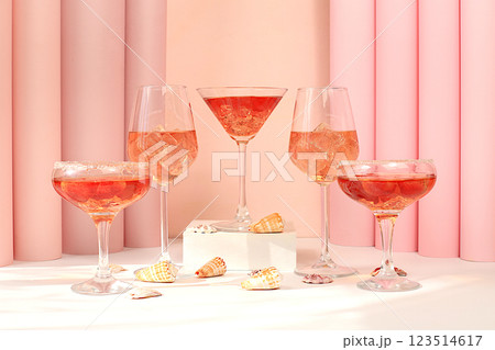 Modern summer still life with pink martini, alcoholic cocktail Aperol spritz, champagne and seashells on elegant modern background, minimal concept for bar and holiday party, cafe, advertising banner Modern summer still life with pink martini, alcoholic cocktail Aperol spritz, champagne and seashells on elegant modern background, minimal concept for bar and holiday party, cafe, advertising banner 123514617