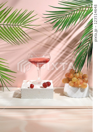 Modern still life with alcoholic margarita cocktail and grapes on pastel background with long hard shadows, minimal concept for bar, cafe, advertising banner, selective focus, space for text 123514648