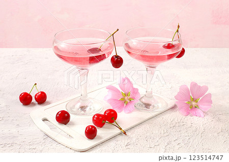 Modern still life with rose wine, alcoholic cocktail and cherry berries on elegant modern background, minimal concept for bar and holiday party, cafe, advertising banner, selective focus, space for 123514747