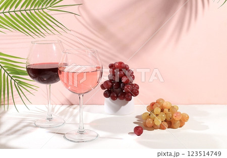 Modern still life with white and red wine, alcoholic margarita cocktail and grapes on pastel background with long hard shadows, minimal concept for bar, cafe, advertising banner, selective focus, Modern still life with white and red wine, alcoholic margarita cocktail and grapes on pastel background with long hard shadows, minimal concept for bar, cafe, advertising banner, selective focus, 123514749