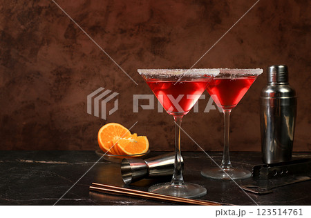 Festive alcoholic cocktail with red martini, lemonade, champagne in glasses on a dark background, bar concept, alcoholic drinks at a party, advertising for a restaurant, selective focus 123514761
