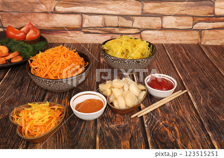 Korean side dishes, carrots, cabbage, kimchi and various kinds of vegetables, a set of fermented products, the concept of a detox diet, healthy and natural food, selective focus 123515251