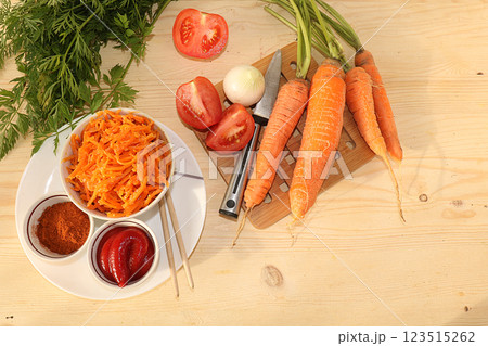 Korean side dish for barbecue dinner, carrots with sauce and hot pepper, A set of fermented foods that are good for intestinal health, carrots, cabbage, garlic, kimchi. top view of glass bowls on 123515262