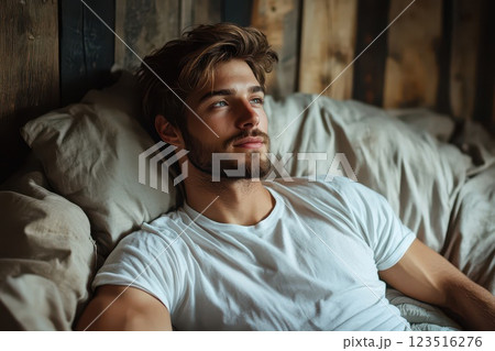Relaxed man gazing thoughtfully in cozy room Relaxed man gazing thoughtfully in cozy room 123516276