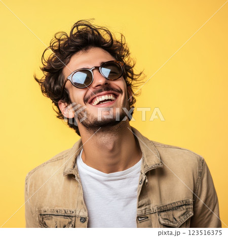 Man in sunglasses on yellow background 123516375