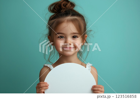 Adorable girl with a cute smile and charming expression in a joyful portrait 123516858