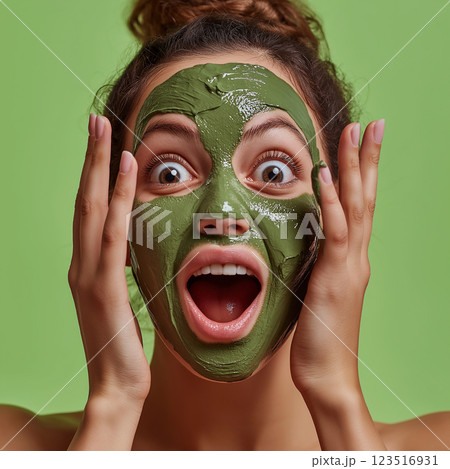 Woman enjoying a skincare facial with green mask in a spa for refreshing beauty treatment Woman enjoying a skincare facial with green mask in a spa for refreshing beauty treatment 123516931