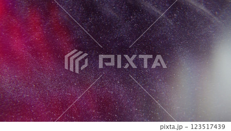 Light glow. Defocused glare reflection. Dark red lens flare twinkling flashing shining flicker on blurred art abstract with bokeh effect. 123517439