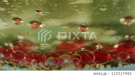 Sinking bubble. Diffusion gel. Colored ingredient bottom. Mixing liquid component changing lighting tones. Underwater macro scene chemical process. 123517492