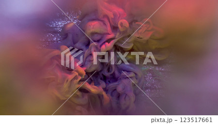Smoke explosion. Pigment stream. Shiny spray colorful mix powder paint cloud on shimmering abstract background round defocused water lens. 123517661