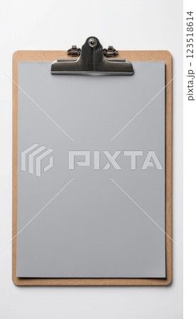 Tan clipboard with blank paper. Suitable for office, education, or presentation purposes. 123518614
