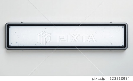 A rectangular, gray-framed sign featuring a smooth white surface, suitable for displaying information or directions in office spaces, schools, or public buildings. 123518954