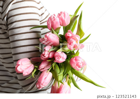 8 March, International Women's Day, woman in a striped sweater with a bouquet of pink tulips in her hands, space for text, isolated on white background, PNG 123521143