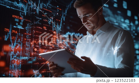 Businessman Analyzing Data on Tablet with Graphs and Charts Displayed 123522103