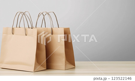 Brown Paper Bags on a Wooden Table Against a Light Background Brown Paper Bags on a Wooden Table Against a Light Background 123522146
