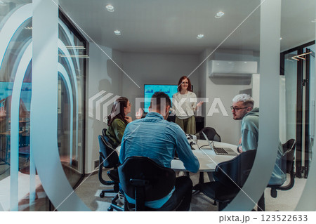 A group of young business entrepreneurs engages in a focused meeting, discussing various business strategies and collaboratively solving challenging problems, showcasing ambition, creativity, and 123522633