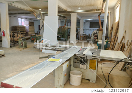 Interior of Wood Processing Industry Featuring CNC Cutting Machines and Wood Processing Equipment 123522957