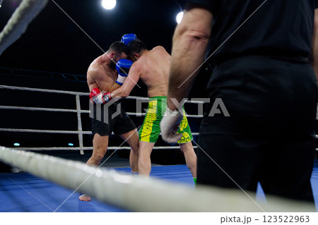 Fierce boxing match showcases athletes' power and skill. Fierce boxing match showcases athletes' power and skill. 123522963