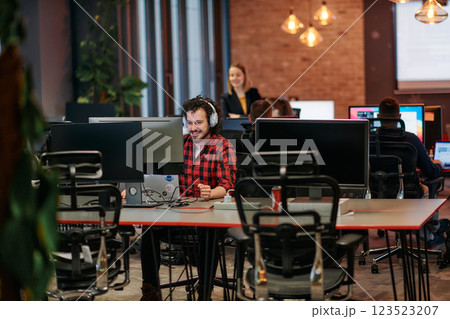Strategic Business Meeting: Group of Professionals Collaborating in Office Using Computers 123523207