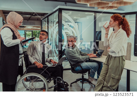 Young group of business people brainstorming together in a startup space, discussing business projects, investments, and solving challenges. Young group of business people brainstorming together in a startup space, discussing business projects, investments, and solving challenges. 123523571