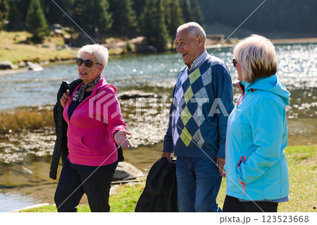 A family shares delightful moments with their friends amid the stunning landscapes of mountains, lakes, and winding paths, promoting a healthy lifestyle and the joy of familial bonds in the embrace of A family shares delightful moments with their friends amid the stunning landscapes of mountains, lakes, and winding paths, promoting a healthy lifestyle and the joy of familial bonds in the embrace of 123523668