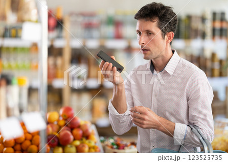 Man holding phone and recording audio 123525735