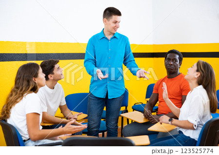 Men and women chatting in conversation club Men and women chatting in conversation club 123525774