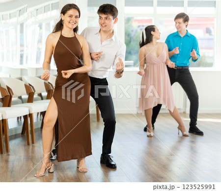 Couple young woman and man dancing twist Couple young woman and man dancing twist 123525991
