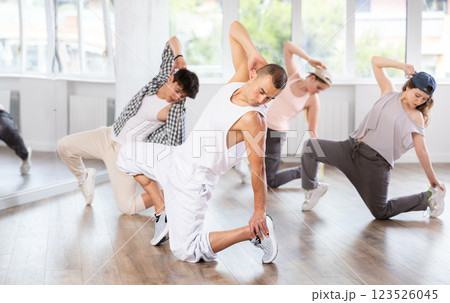 Break dance performed by a group of young dancers in dance studio Break dance performed by a group of young dancers in dance studio 123526045
