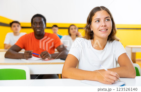 Young woman attending lecture in taxi training school 123526140