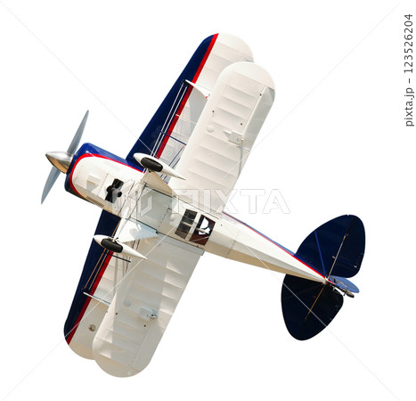 Sports biplane performing aerobatic elements 123526204
