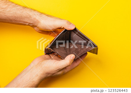 Empty wallet reflects the struggles of financial hardship and poverty Empty wallet reflects the struggles of financial hardship and poverty 123526443