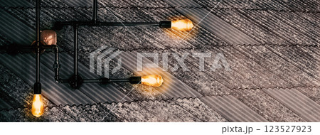 black metal lamp on rough gray roof banner background black metal lamp on rough gray roof banner background 123527923