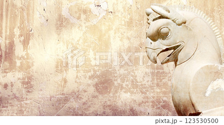 Background with stone statue of mythical griffin, Persepolis, Iran. Horizontal banner with assyrian protective deity. Topic of summer vacation, travel, trip abroad on vacation, cruises and tours Background with stone statue of mythical griffin, Persepolis, Iran. Horizontal banner with assyrian protective deity. Topic of summer vacation, travel, trip abroad on vacation, cruises and tours 123530500