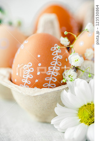 A delicate Easter background with hand-painted eggs 123530864
