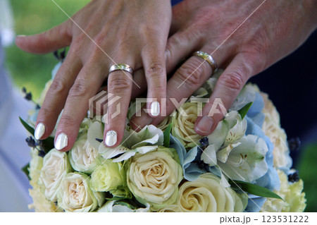 blue wedding flowers with human hands 123531222
