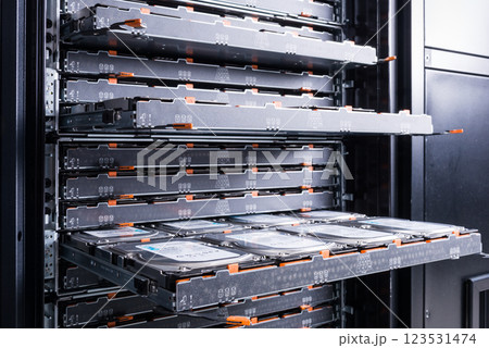 Cluster of hard drives inside open tray Cluster of hard drives inside open tray 123531474