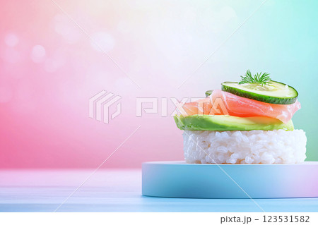 Chic snack rice cakes with avocado, smoked salmon, styled on a pastel background 123531582