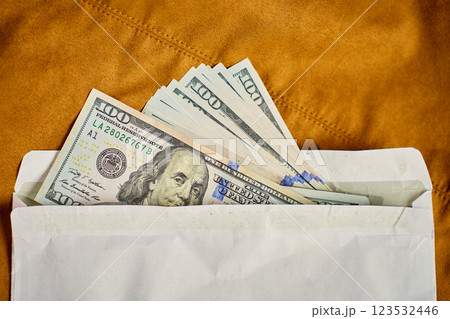 Dollar bills in envelope. Corruption and illegal cash payments Dollar bills in envelope. Corruption and illegal cash payments 123532446