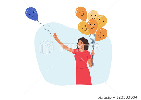 Woman releasing negative emotions in form of balloon with sad grimace, for care of mental wellbeing Woman releasing negative emotions in form of balloon with sad grimace, for care of mental wellbeing 123533004