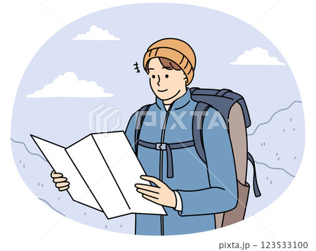 Male traveler check map trekking in mountains 123533100