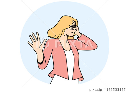 Woman closes eyes and makes stop gesture, expressing dissatisfaction and disagreement 123533155