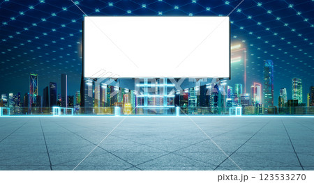 Blank billboard standing on rooftop with illuminated futuristic cityscape view at night 123533270